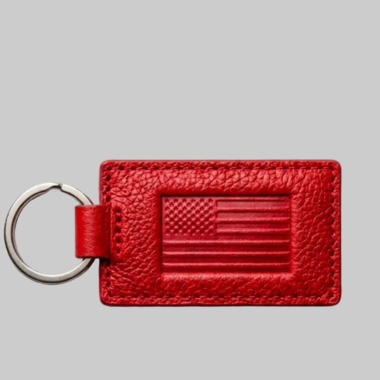 Red leather keychain with American flag design on a gray background