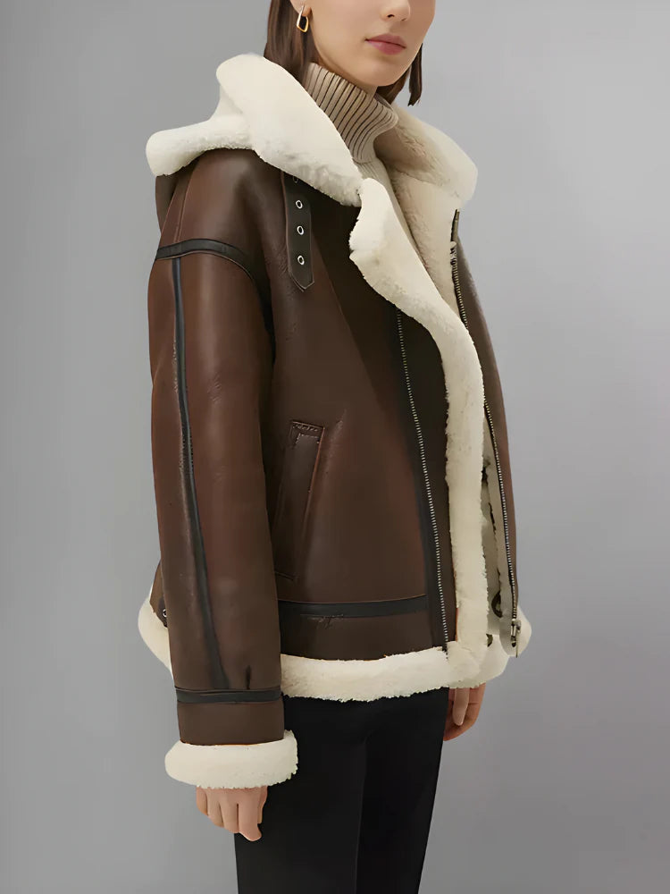 Brown leather jacket with white fur lining on a gray background