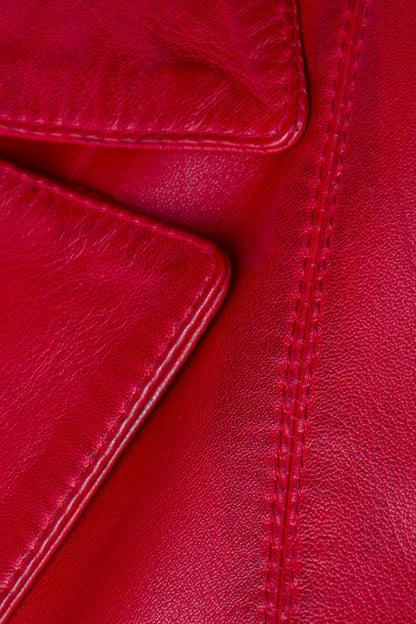 Close-up of red leather with visible stitching
