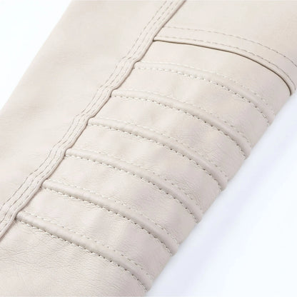 Close-up of beige quilted fabric with visible stitching on a white background