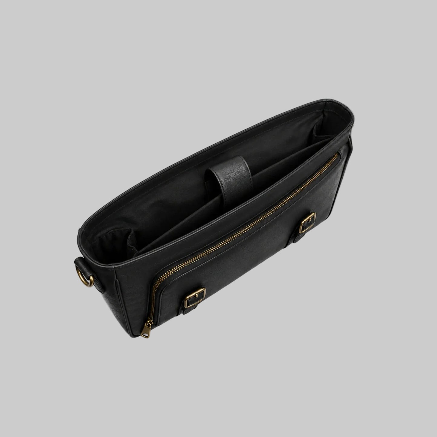 Black handbag with gold zippers on a white background