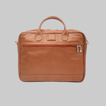 A brown leather briefcase with top handles, a front zippered pocket, and silver zipper pulls, photographed against a plain white background.