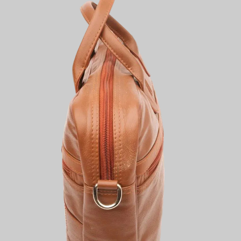 Brown leather bag with a gold buckle on a white background