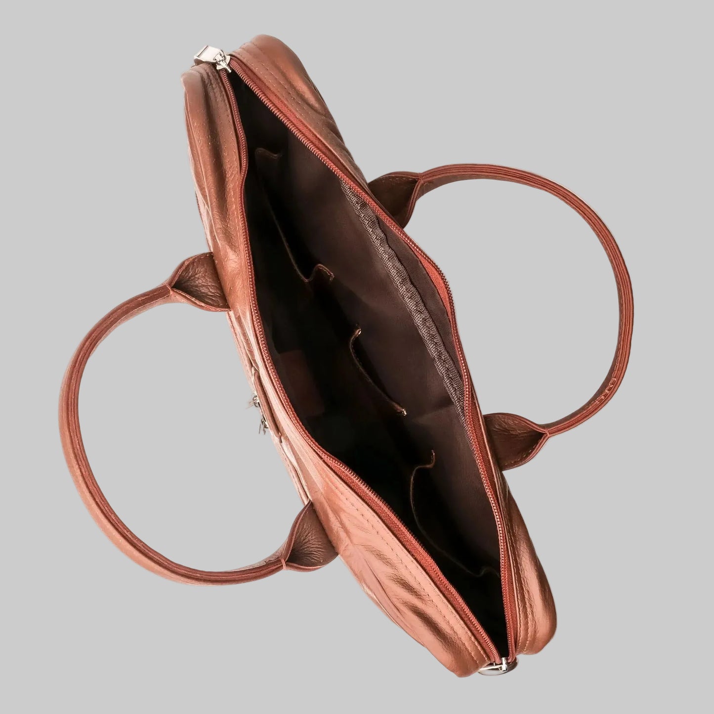 Brown leather handbag with open top on a white background