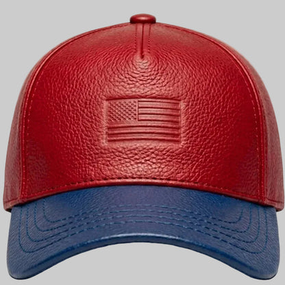 Red and blue leather cap with American flag emblem on a gray background